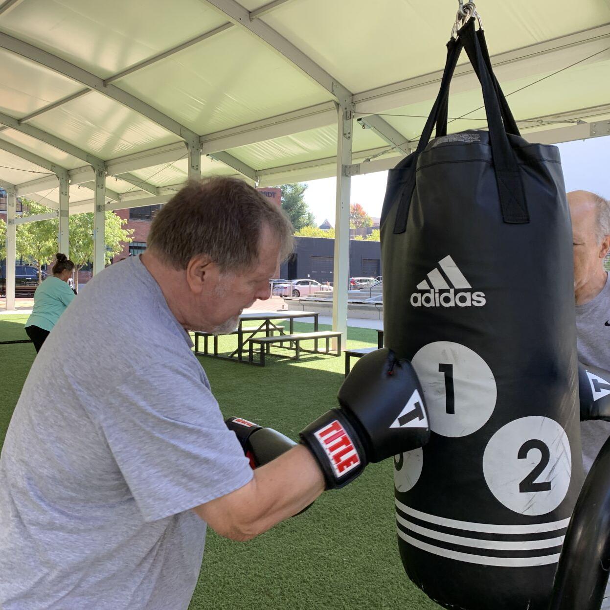Robert Schack hits boxing bag